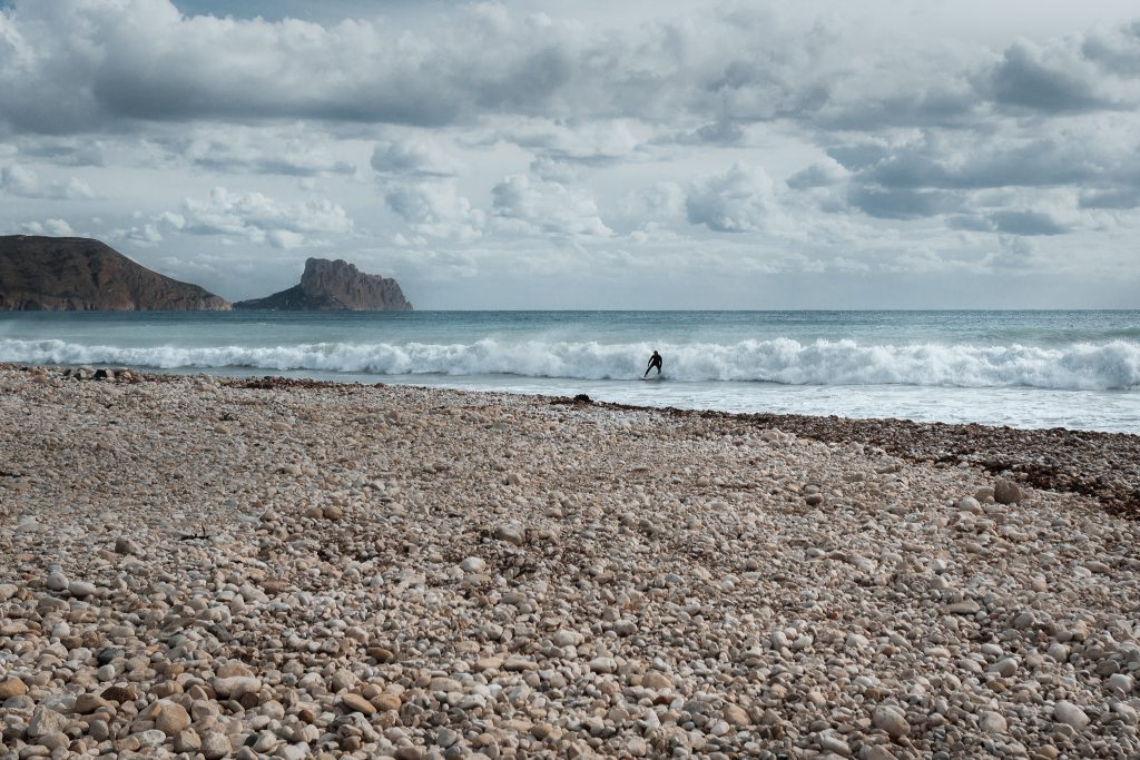 Best beaches in Altea, Spain - pebbly Playa la Roda with view over Penon de Ifach