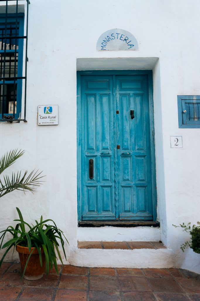 Frigiliana Moorish Quarter - Whitewashed building with blue Doors