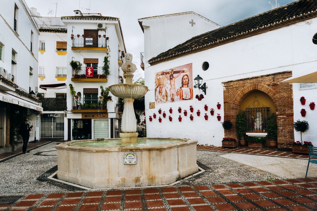 Plaza de los Naranjos Renaissance fountain and Ermita de Santiago